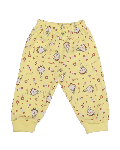 Close-up of lemon yellow baby trousers with all-over ice cream cone, lollipop and star print