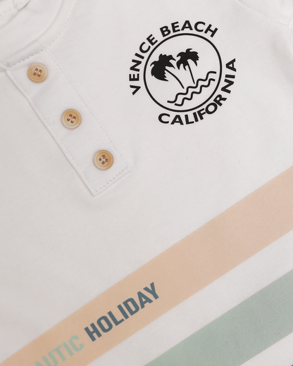 Close-up of Venice Beach California logo and Nautic Holiday stripe detail on white baby tee